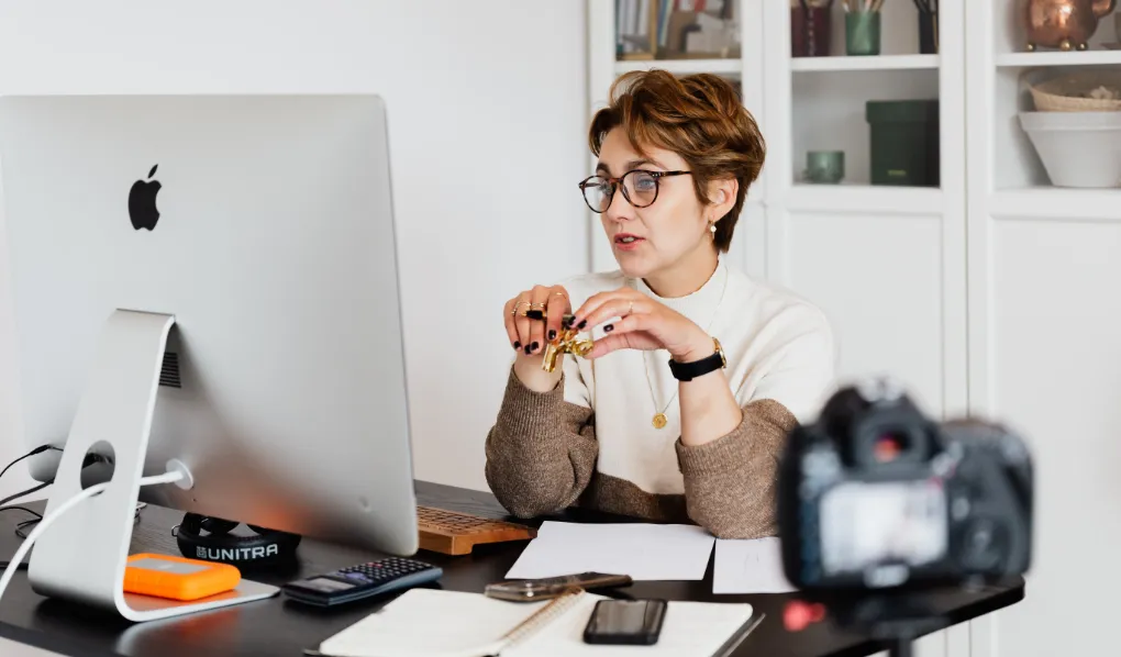 Female eLA teaching online at desk