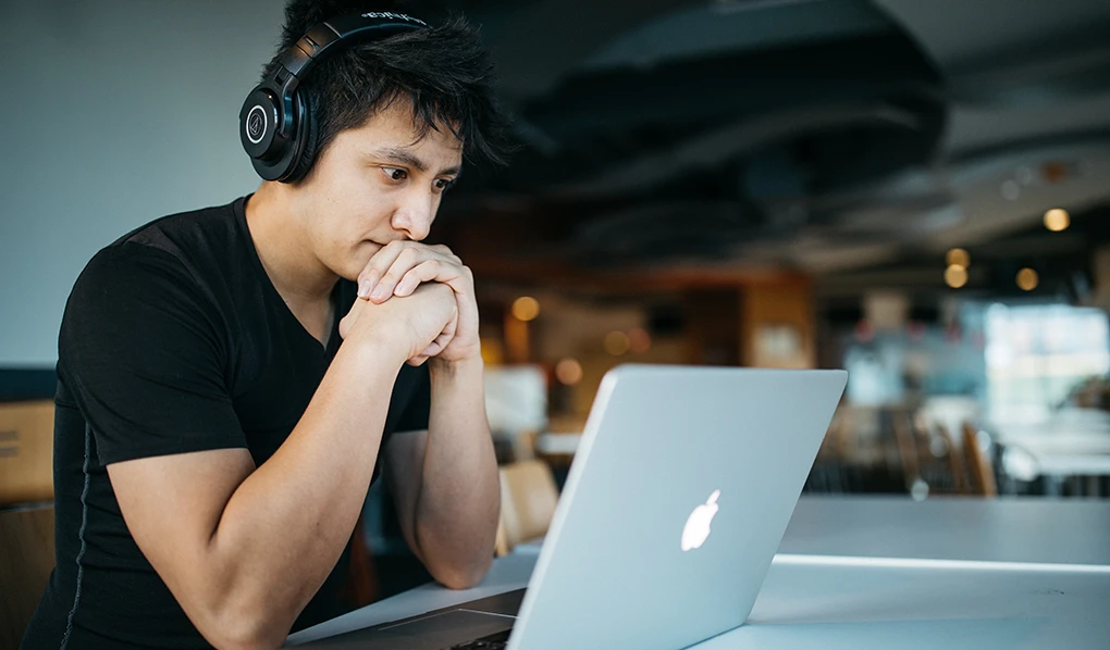 Online student studying diploma of business in a cafe