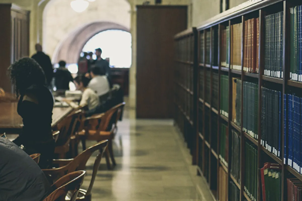 Students studying inside of a library