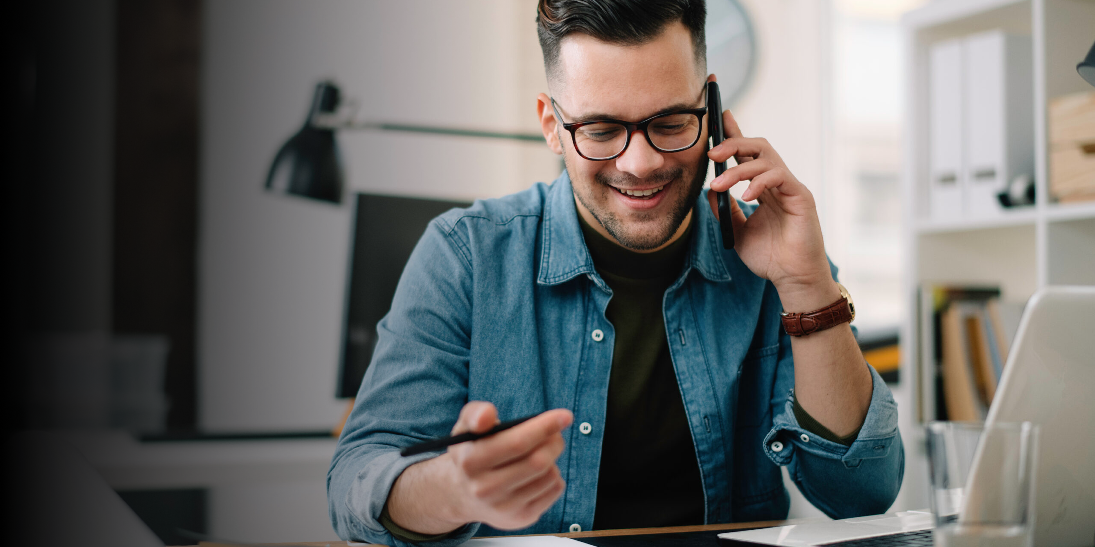 Young man applying via call with Course Consultant