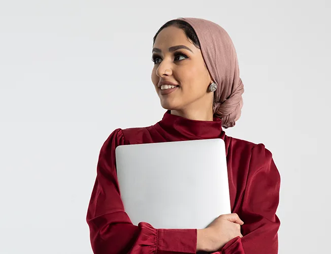 Online student, Mina holding a laptop
