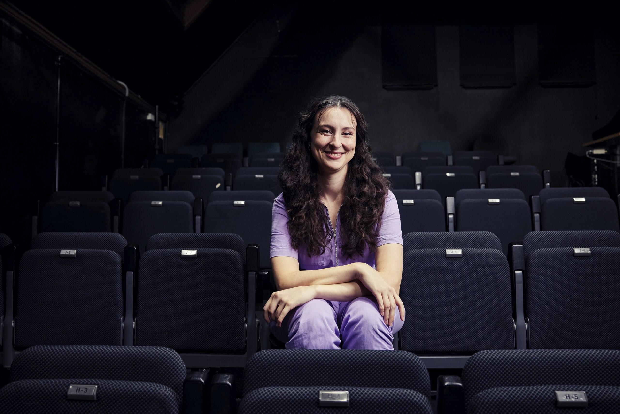 Annabelle sitting in the audience seats