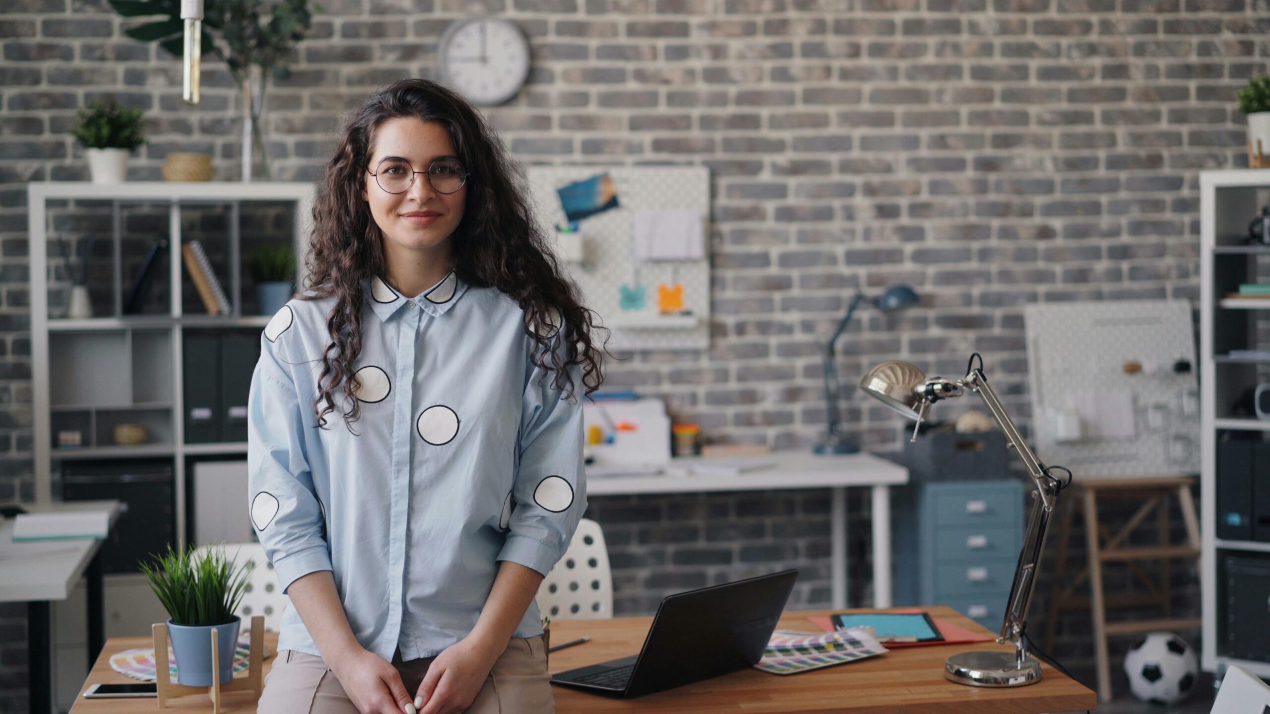 Young female worker in office