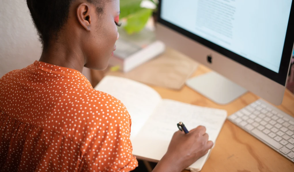 Female student studying and making notes