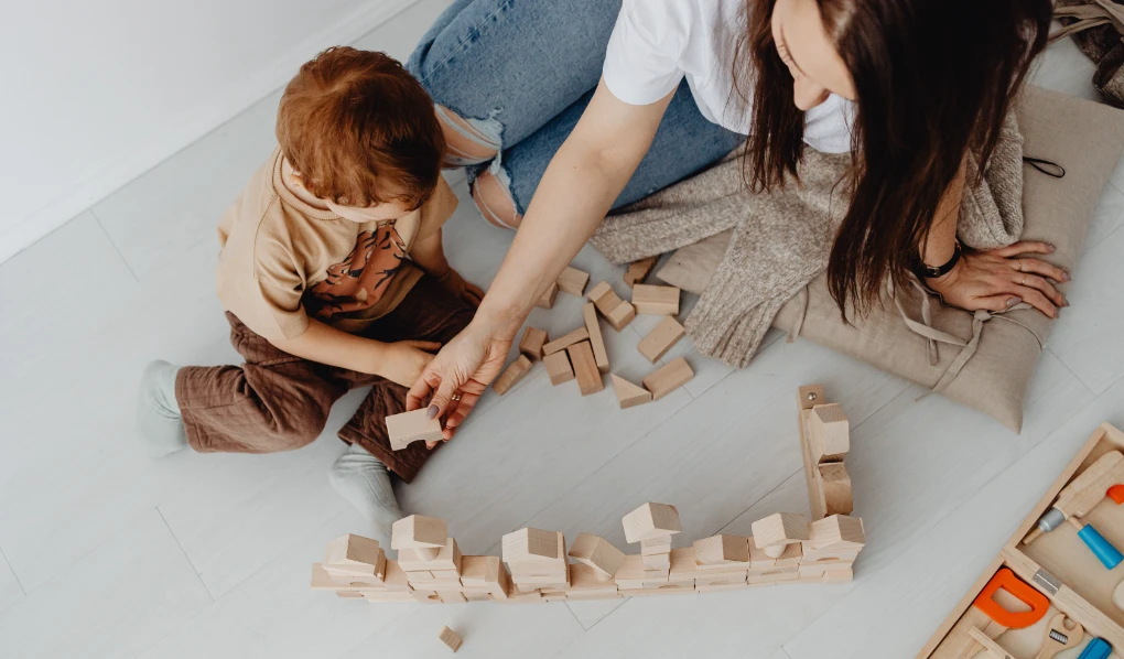 Mom playing with blocks with her son