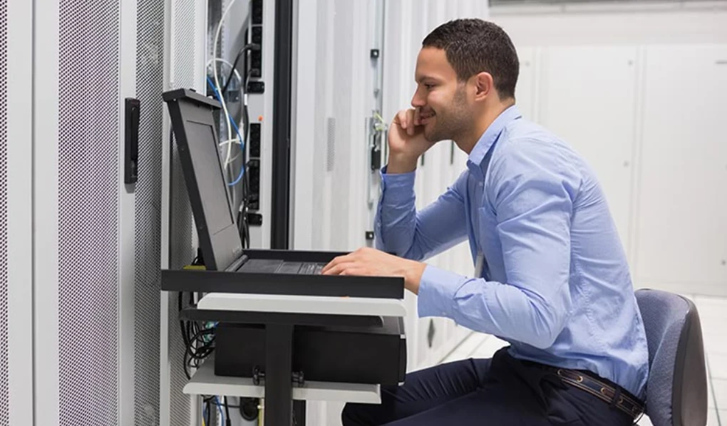 Male cybersecurity expert at work station
