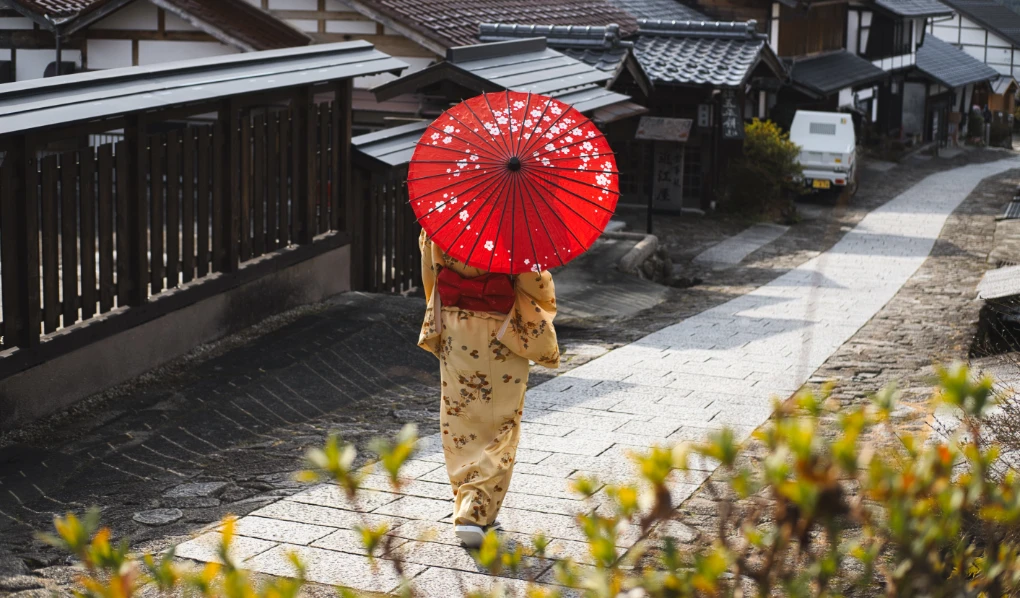 Japanese lady walking down a path