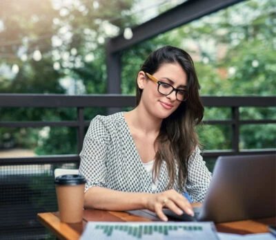 Young woman typing on laptop
